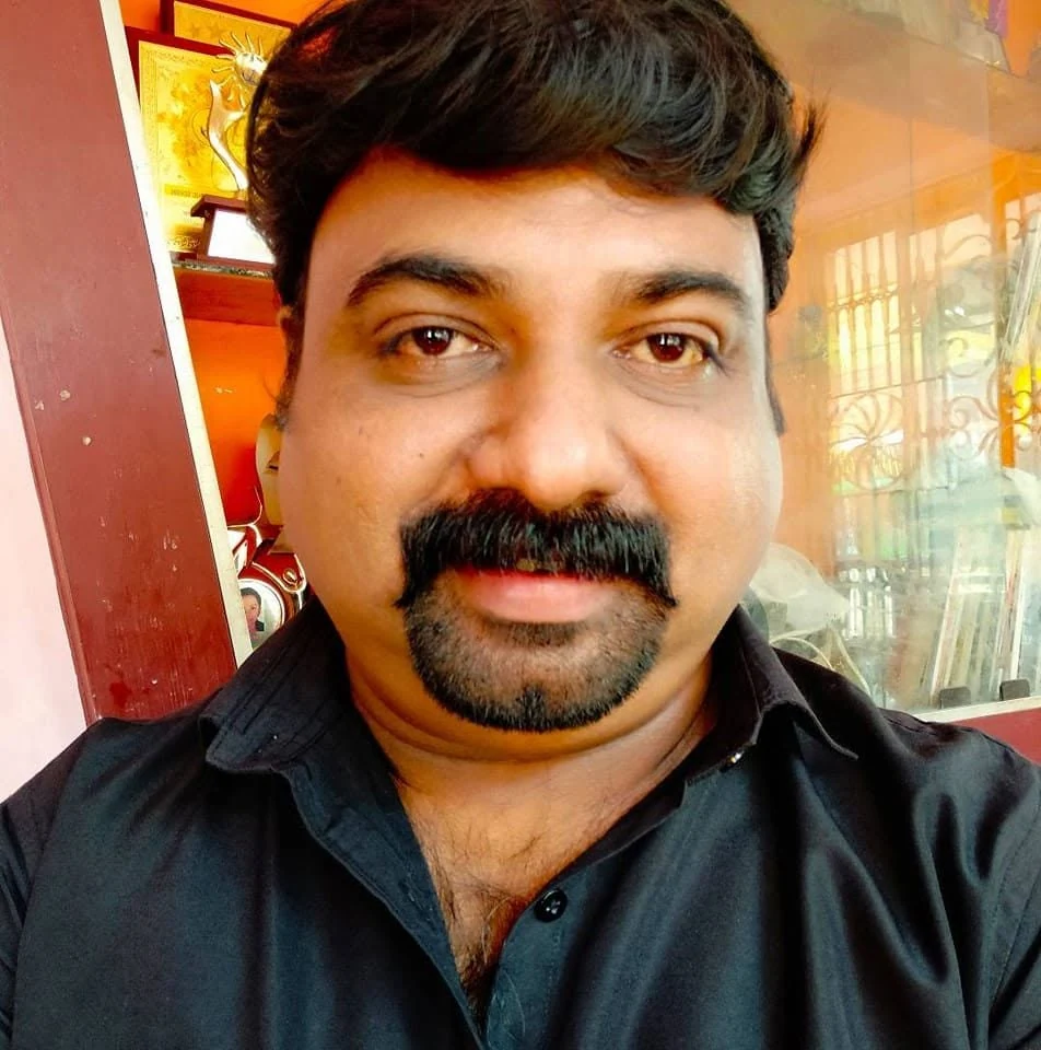 Vyasan Sajeev in a black shirt